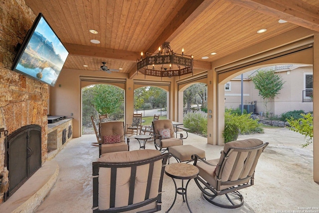 view of patio / terrace with ceiling fan and exterior kitchen