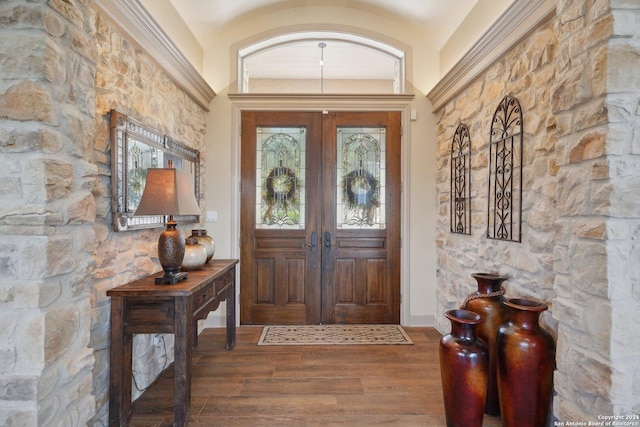 entryway featuring french doors and wood-type flooring