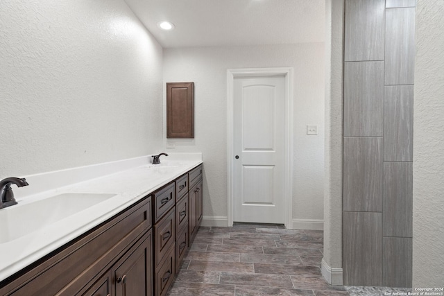 bathroom featuring vanity and wood-type flooring