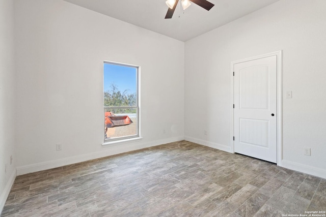 empty room featuring ceiling fan and light hardwood / wood-style flooring