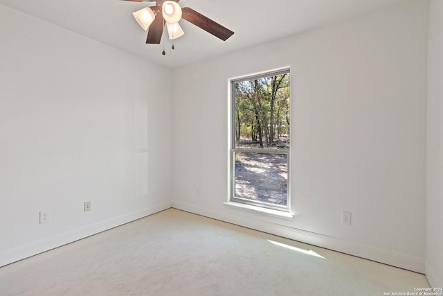 carpeted empty room with ceiling fan