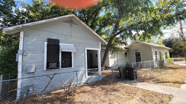 730 S Sabinas St, San Antonio, TX 78207 - shotgun-style home with a gate