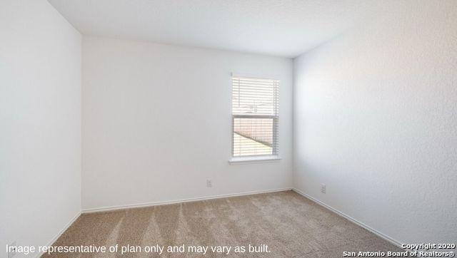 unfurnished room with light colored carpet