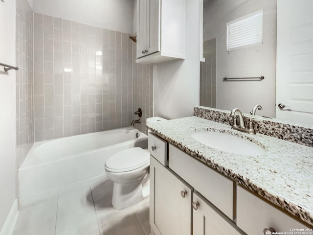 full bathroom with tile patterned floors, tiled shower / bath combo, toilet, and vanity