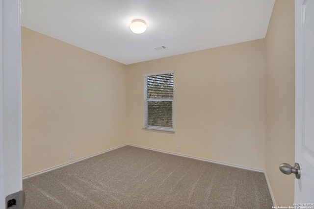 empty room with light colored carpet