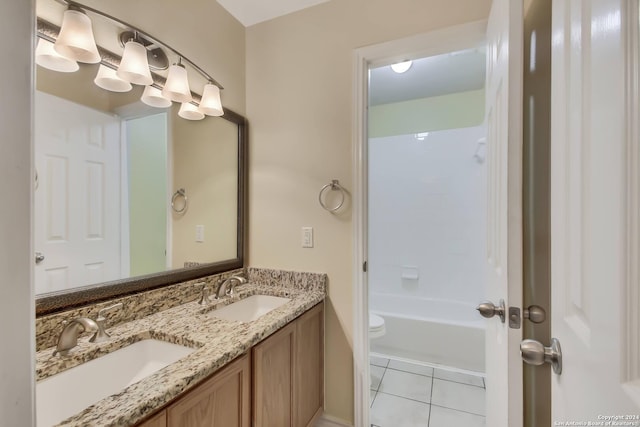 full bathroom featuring tile patterned floors, vanity, toilet, and bathing tub / shower combination