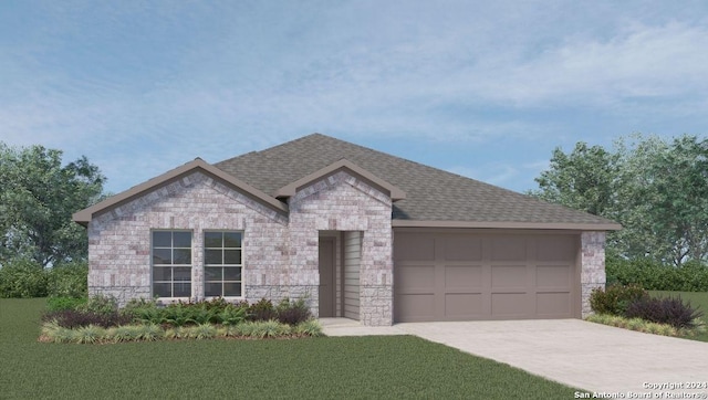 view of front of house featuring a garage and a front lawn