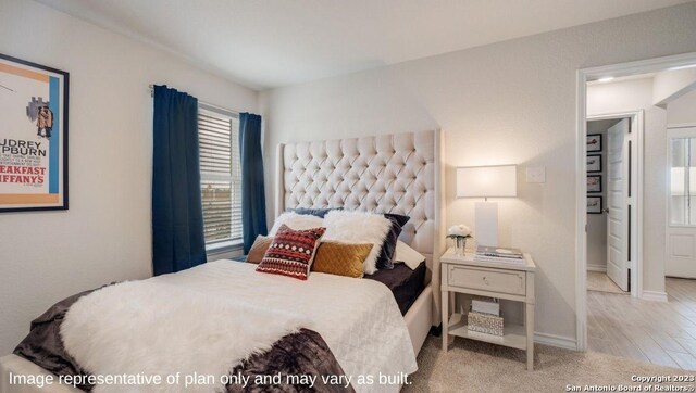 bedroom with light wood-type flooring