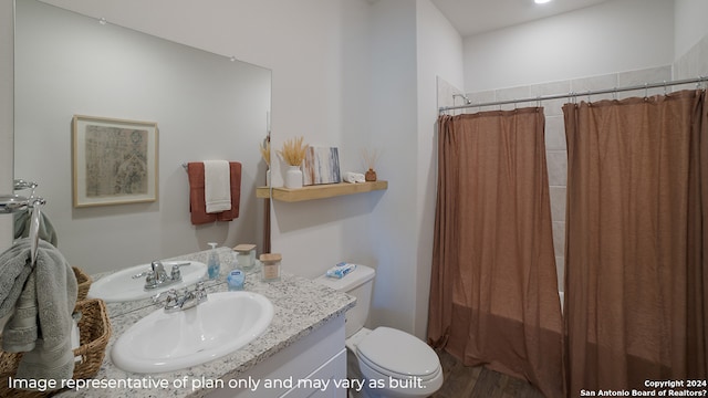 full bathroom with shower / bath combo with shower curtain, hardwood / wood-style floors, vanity, and toilet