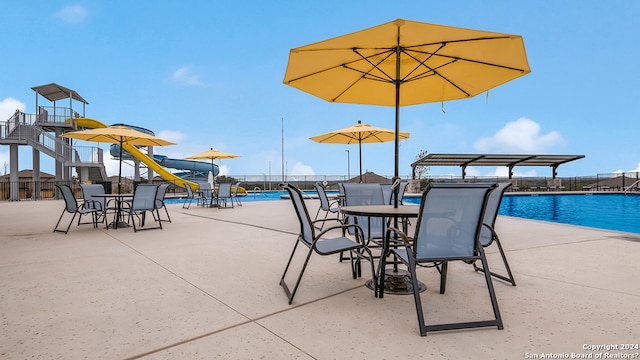 view of patio featuring a community pool