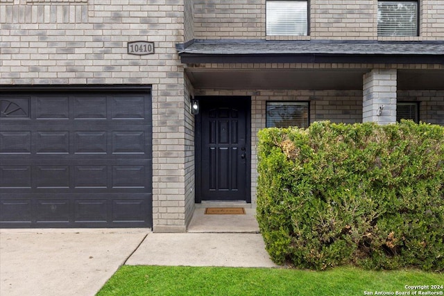 property entrance with a garage