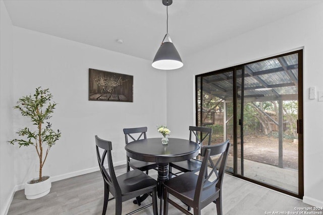 dining room with hardwood / wood-style flooring