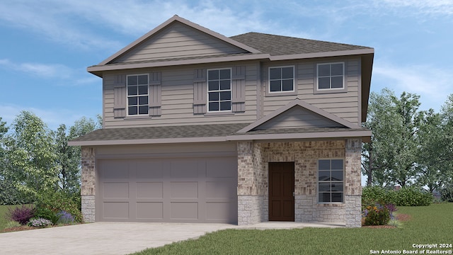 view of front of home with a garage and a front yard