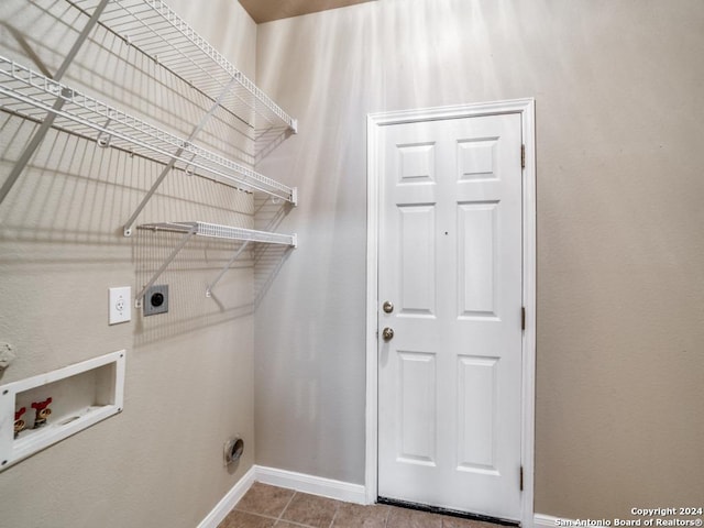 clothes washing area with washer hookup, tile patterned floors, and electric dryer hookup