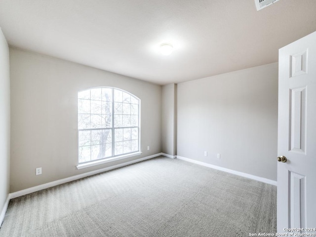 spare room with carpet floors