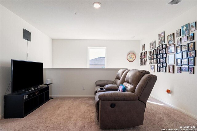 living area with light carpet