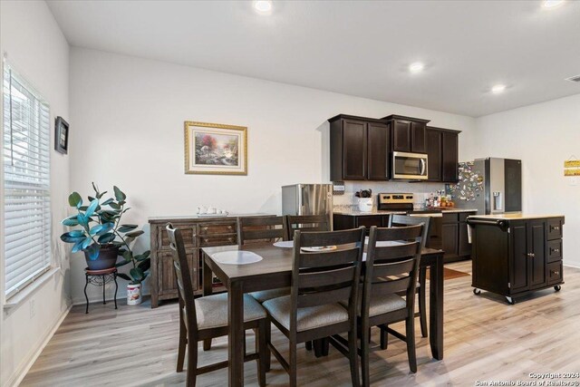 dining area with light hardwood / wood-style flooring