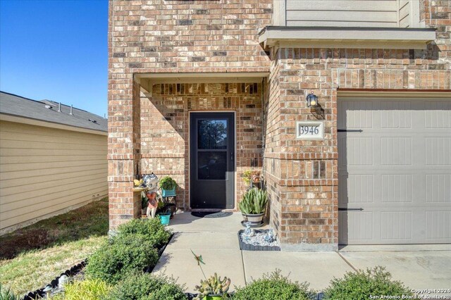 doorway to property featuring a garage