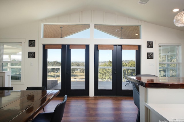 entryway featuring lofted ceiling, french doors, a healthy amount of sunlight, and dark hardwood / wood-style floors