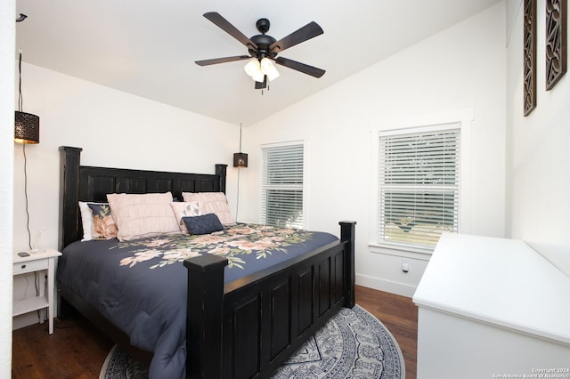 bedroom featuring dark hardwood / wood-style flooring, ceiling fan, and lofted ceiling