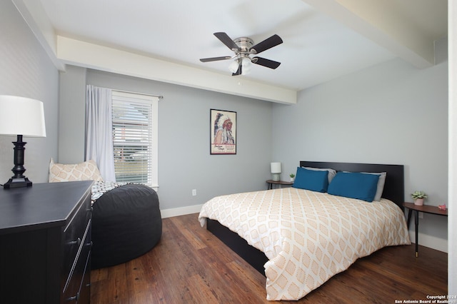 bedroom featuring beamed ceiling, dark hardwood / wood-style floors, and ceiling fan