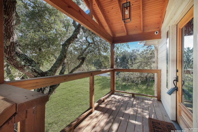 wooden terrace with a yard