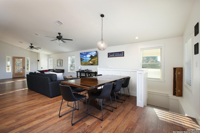 dining area with ceiling fan, hardwood / wood-style floors, a healthy amount of sunlight, and lofted ceiling