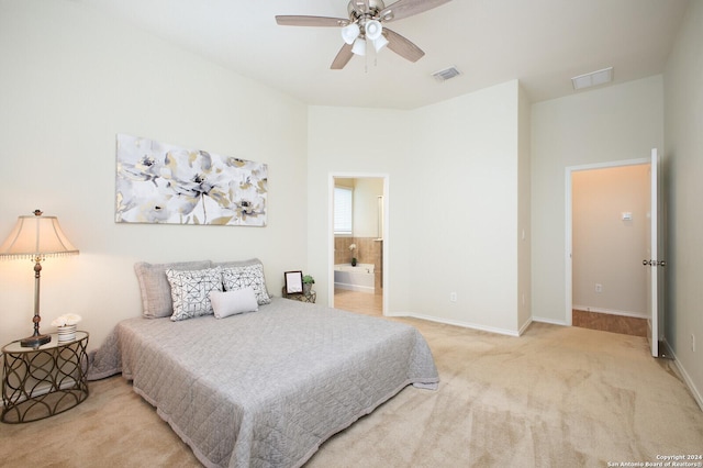 carpeted bedroom featuring ensuite bathroom and ceiling fan