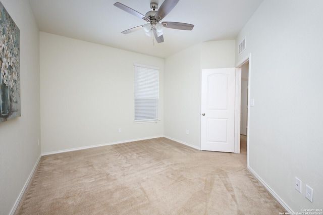 empty room with light carpet and ceiling fan