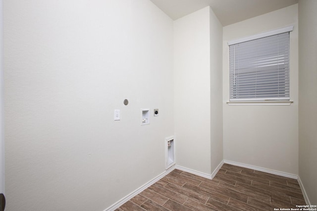 washroom with hookup for an electric dryer, hookup for a washing machine, and dark hardwood / wood-style floors