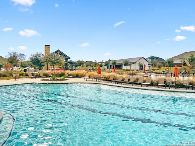 view of pool featuring a patio area