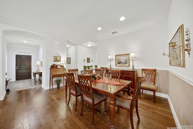 dining space with dark wood-type flooring