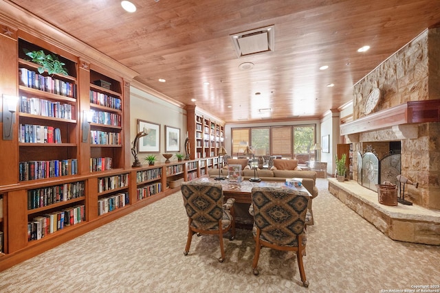 carpeted dining room featuring a fireplace, crown molding, and wood ceiling