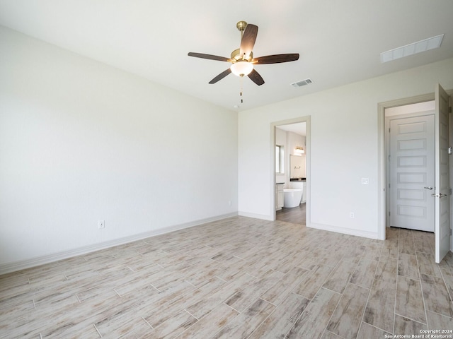 unfurnished bedroom with light wood-type flooring, ensuite bathroom, and ceiling fan