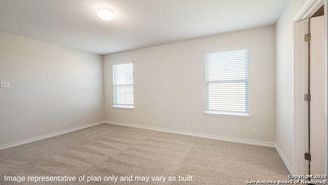 carpeted empty room featuring a wealth of natural light