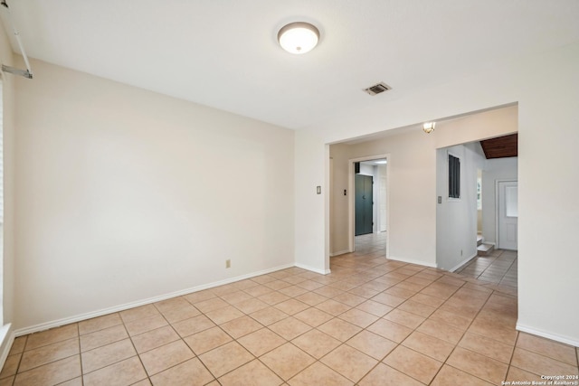 empty room featuring light tile patterned floors