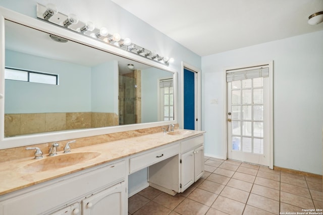 bathroom with tile patterned flooring and vanity