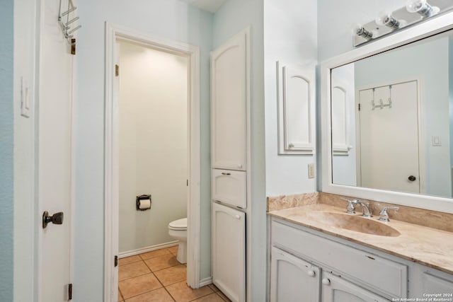 bathroom with tile patterned floors, vanity, and toilet