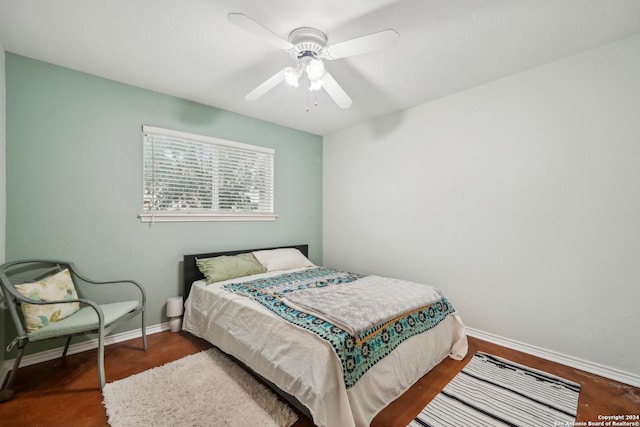 bedroom featuring ceiling fan and dark wood-type flooring