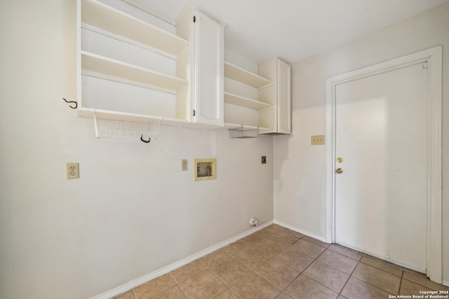 laundry area featuring hookup for an electric dryer, washer hookup, and light tile patterned flooring