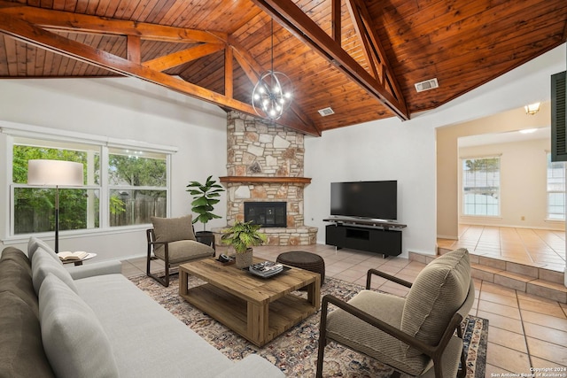 tiled living room featuring a fireplace, high vaulted ceiling, wood ceiling, and an inviting chandelier