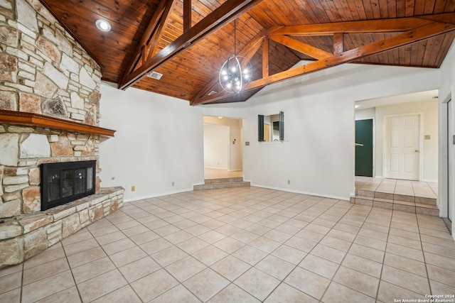 unfurnished living room with beamed ceiling, wooden ceiling, a fireplace, and high vaulted ceiling