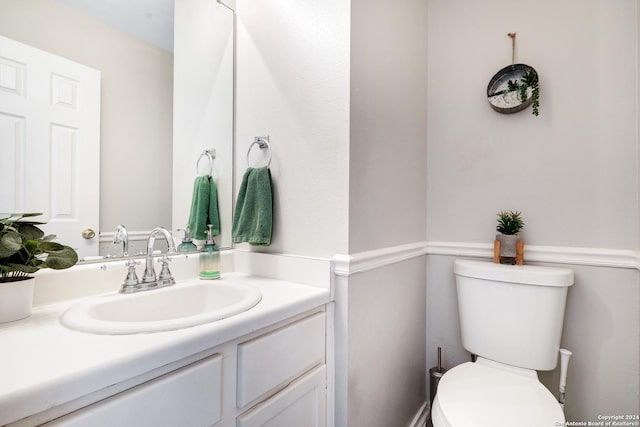 bathroom with vanity and toilet