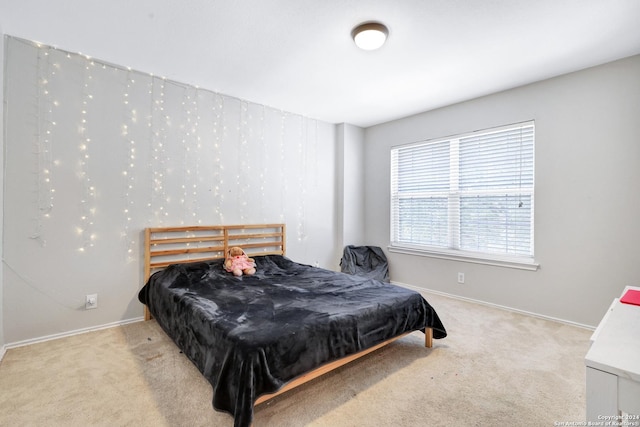 bedroom with light carpet