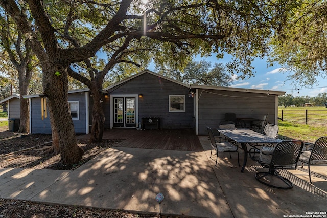 back of property featuring a wooden deck