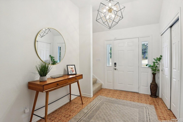 foyer featuring a chandelier