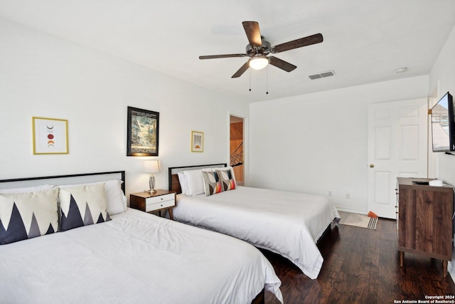 bedroom featuring ceiling fan and dark wood-type flooring