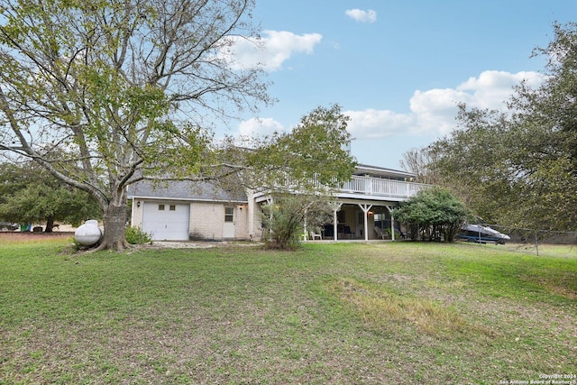 exterior space with a garage and a lawn