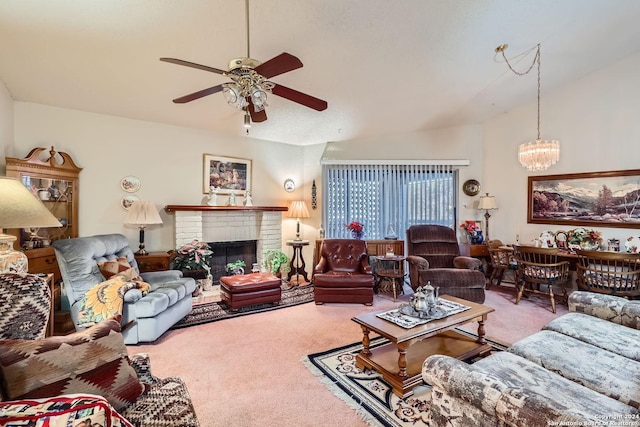 carpeted living room featuring ceiling fan with notable chandelier and a brick fireplace