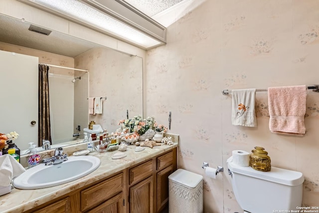 full bathroom with vanity, shower / bathtub combination with curtain, and toilet